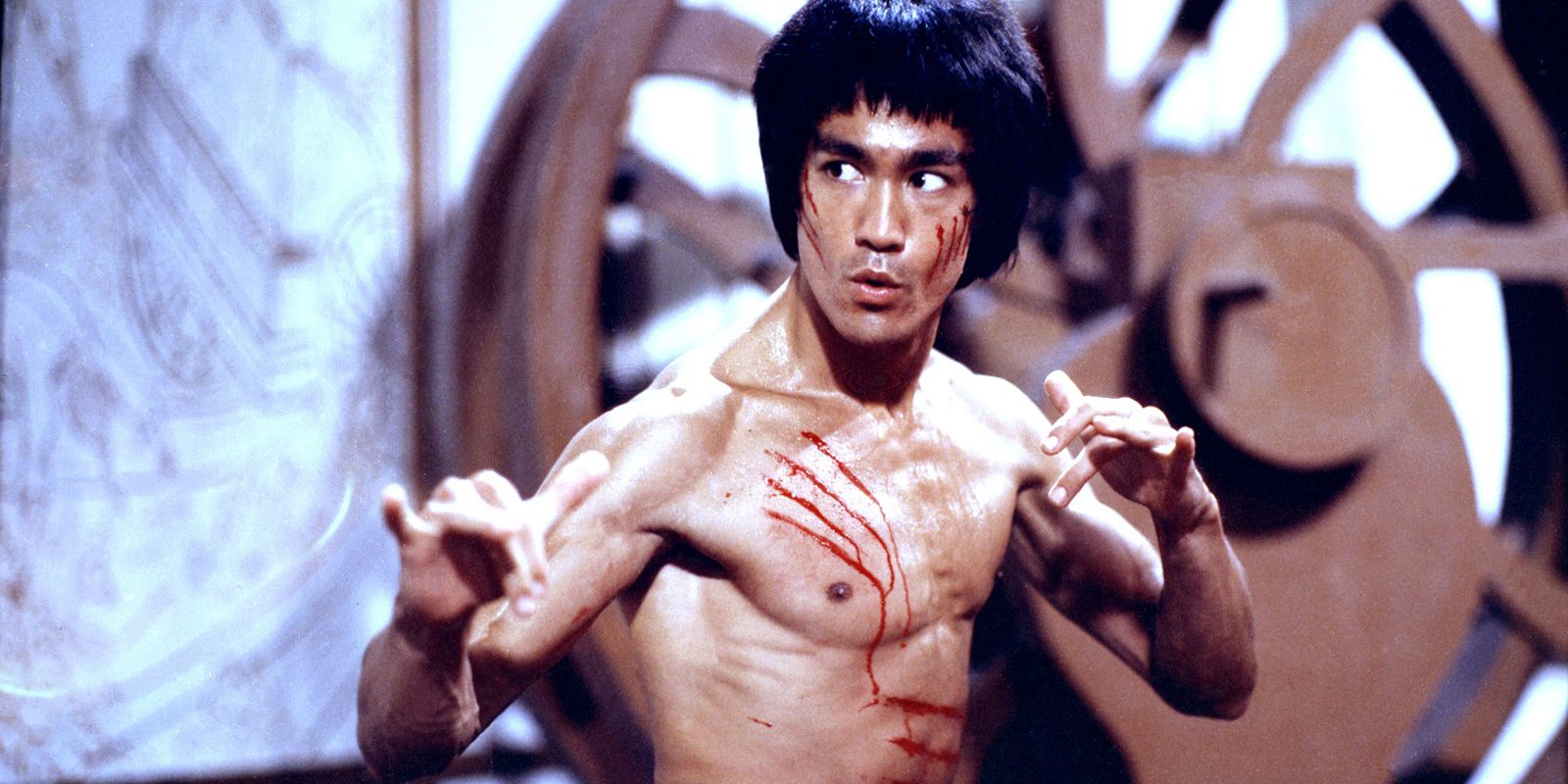 Bruce Lee with an injured chest in Enter the Dragon