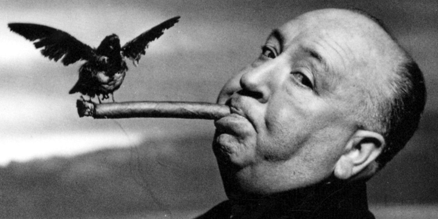 alfred hitchcock with a cigar and bird