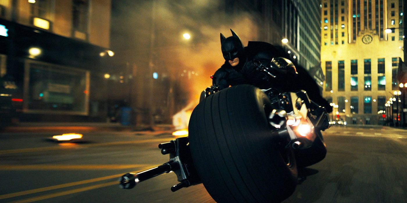 Batman driving the batpod in the Dark Knight Trilogy