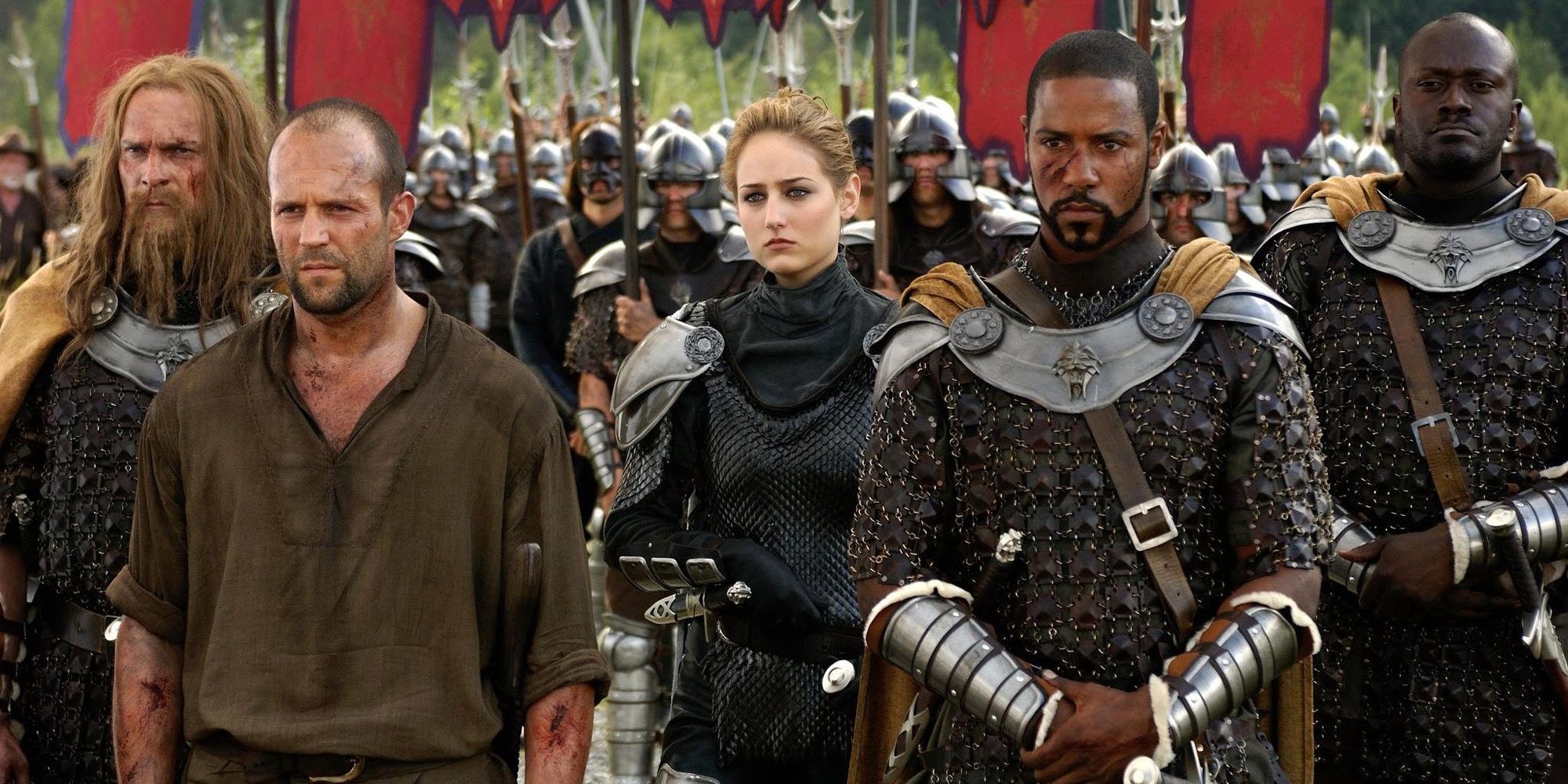 Camden Konreid (Jason Statham) stands next to Muriella (Leelee Sobieski) and Commander Tarish (Brian White) in In the Name of the King: A Dungeon Siege Tale