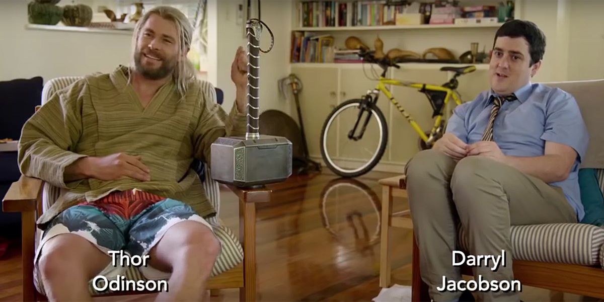Thor and Darryl sitting in a living room