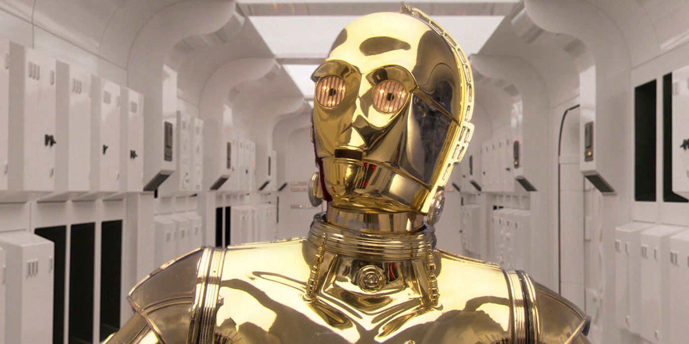 C-3PO stands in a rebel ship corridor during Star Wars: A New Hope