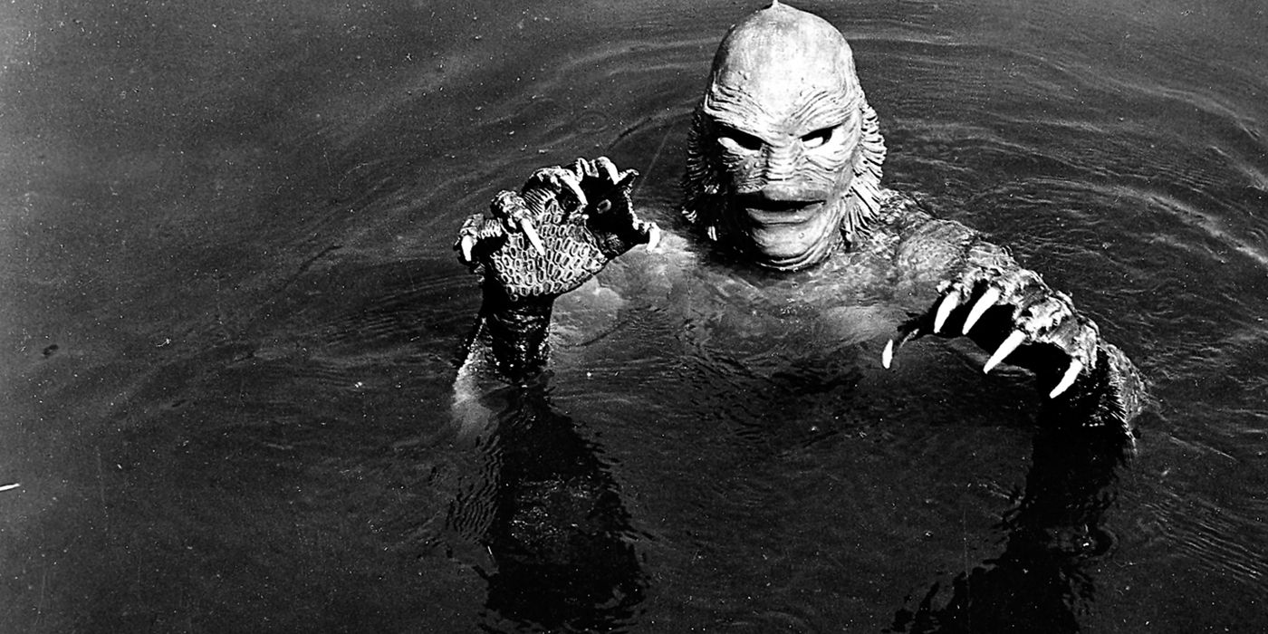 The Creature From the Black Lagoon swims in the water.