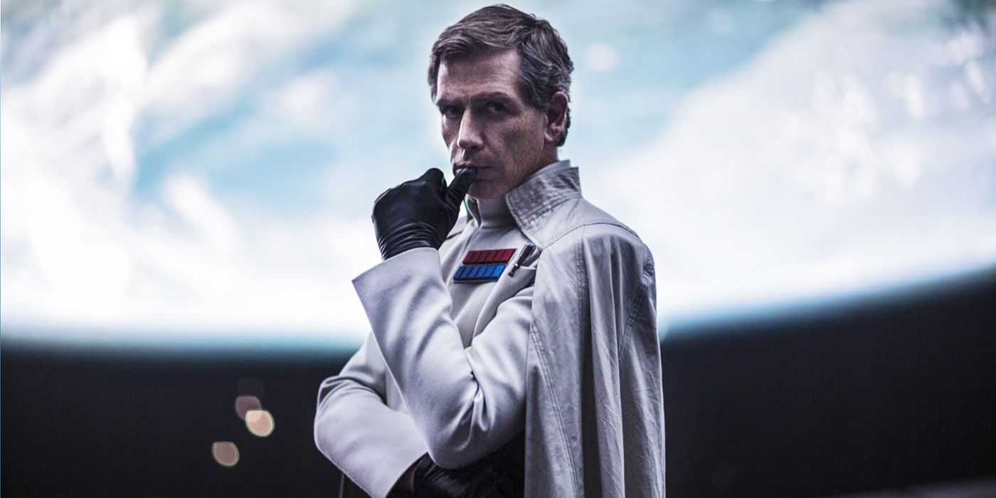 Director Krennic with his thumb on his chin in Rogue One.