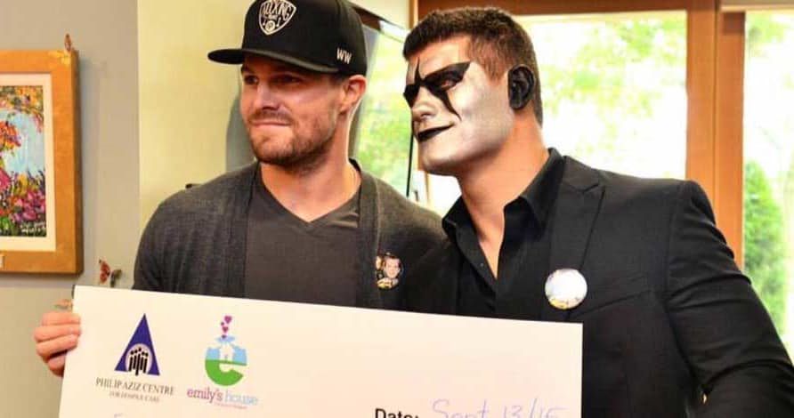 Stephen Amell and Cody Rhodes (as Stardust) presenting a check to Emily&#039;s House