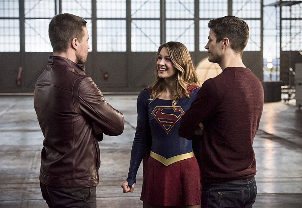The Flash -- Invasion! -- Image FLA308b_0493b.jpg -- Pictured (L-R): Stephen Amell as Oliver Queen, Melissa Benoist as Kara/Supergirl and Grant Gustin as Barry Allen -- Photo: Dean Buscher/The CW -- © 2016 The CW Network, LLC. All rights reserved.