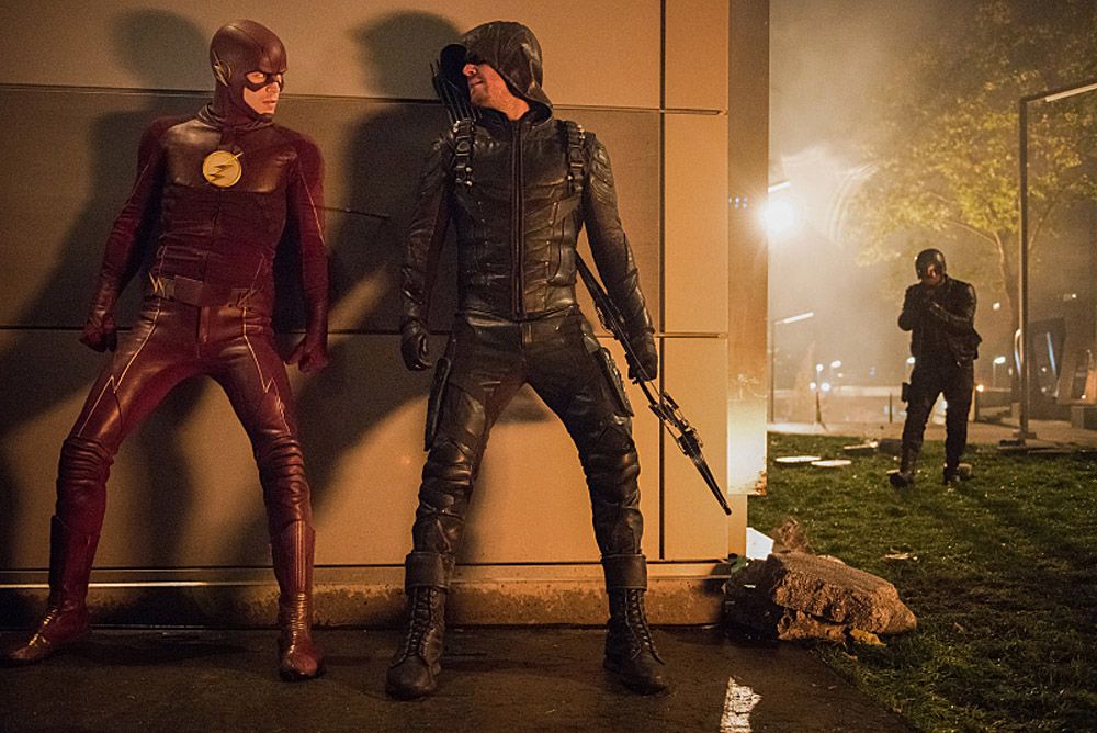 The Flash -- Invasion! -- Image FLA308c_0466.jpg -- Pictured (L-R) Grant Gustin as The Flash, Stephen Amell as Green Arrow and David Ramsey as John Diggle -- Photo: Dean Buscher/The CW -- ÃÂ© 2016 The CW Network, LLC. All rights reserved