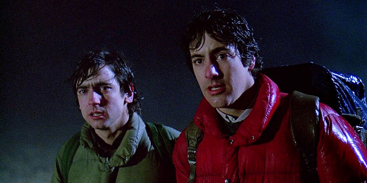 Two hikers stand still, shocked by something off-screen in the film, American Werewolf