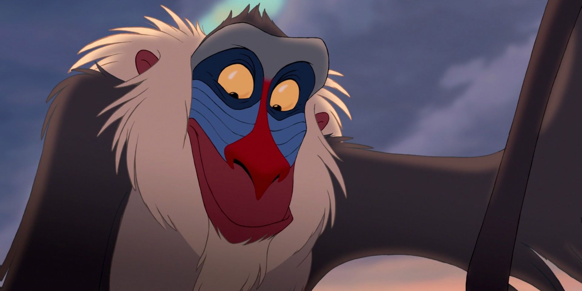 Rafiki smiling while looking down in The Lion King