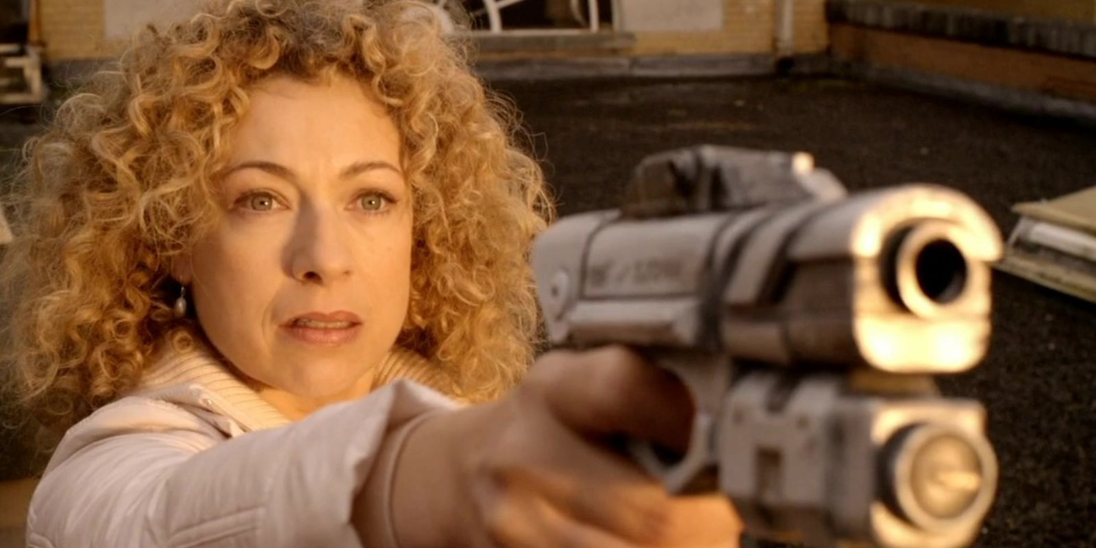 River Song pointing a gun in Doctor Who