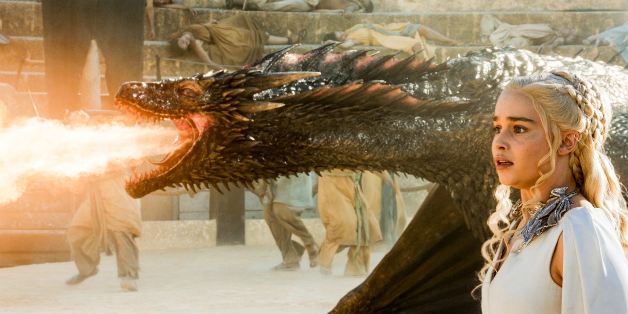 Drogon the Dragon breathes fire next to Daeneryis on Game of Thrones