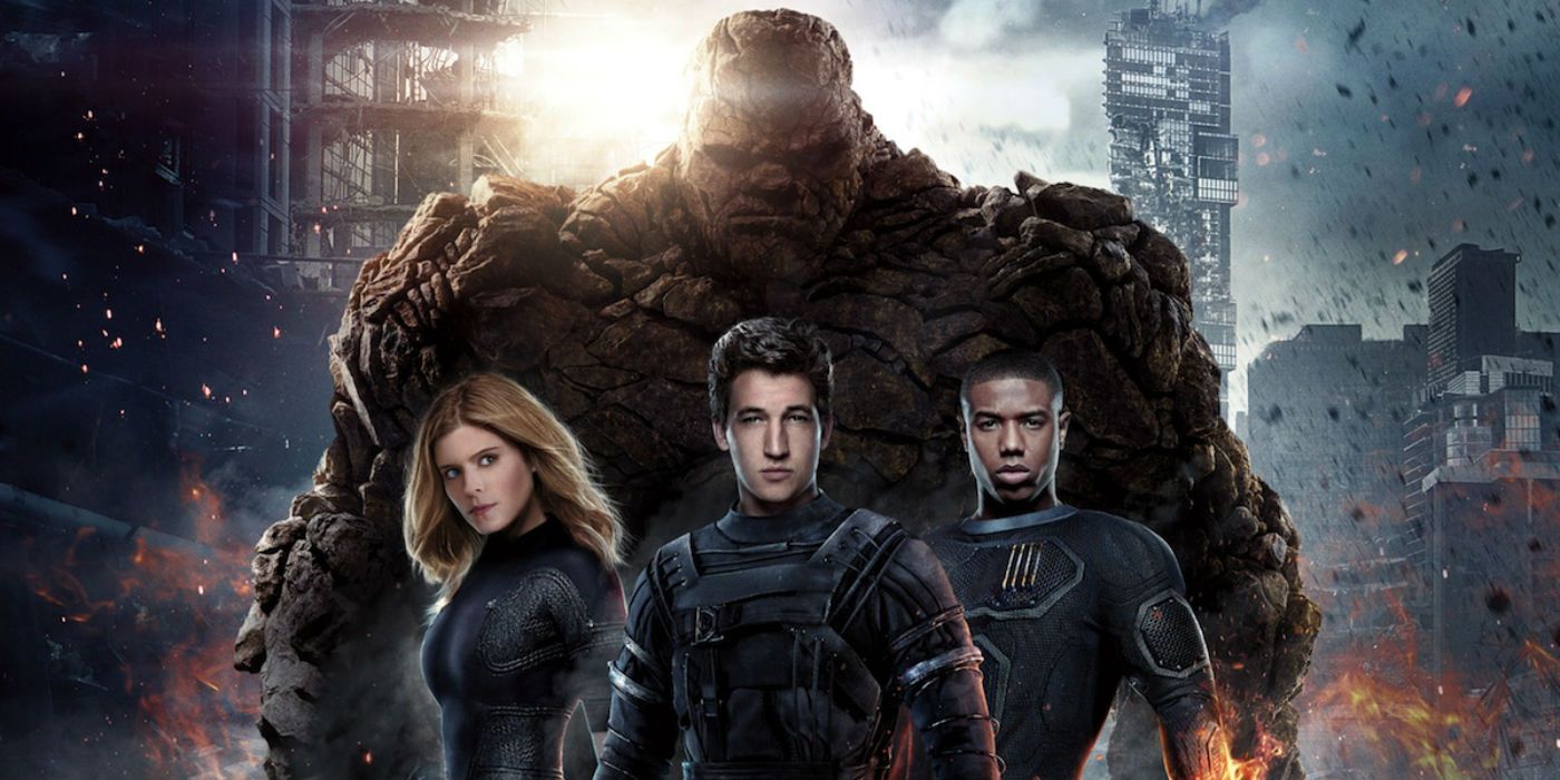 The cast of 2015's Fantastic Four with destroyed buildings behind them.