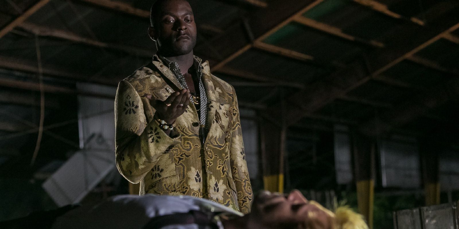 Michael James Shaw as Papa Midnite and Matt Ryan as John Constantine in The Devil's Vinyl