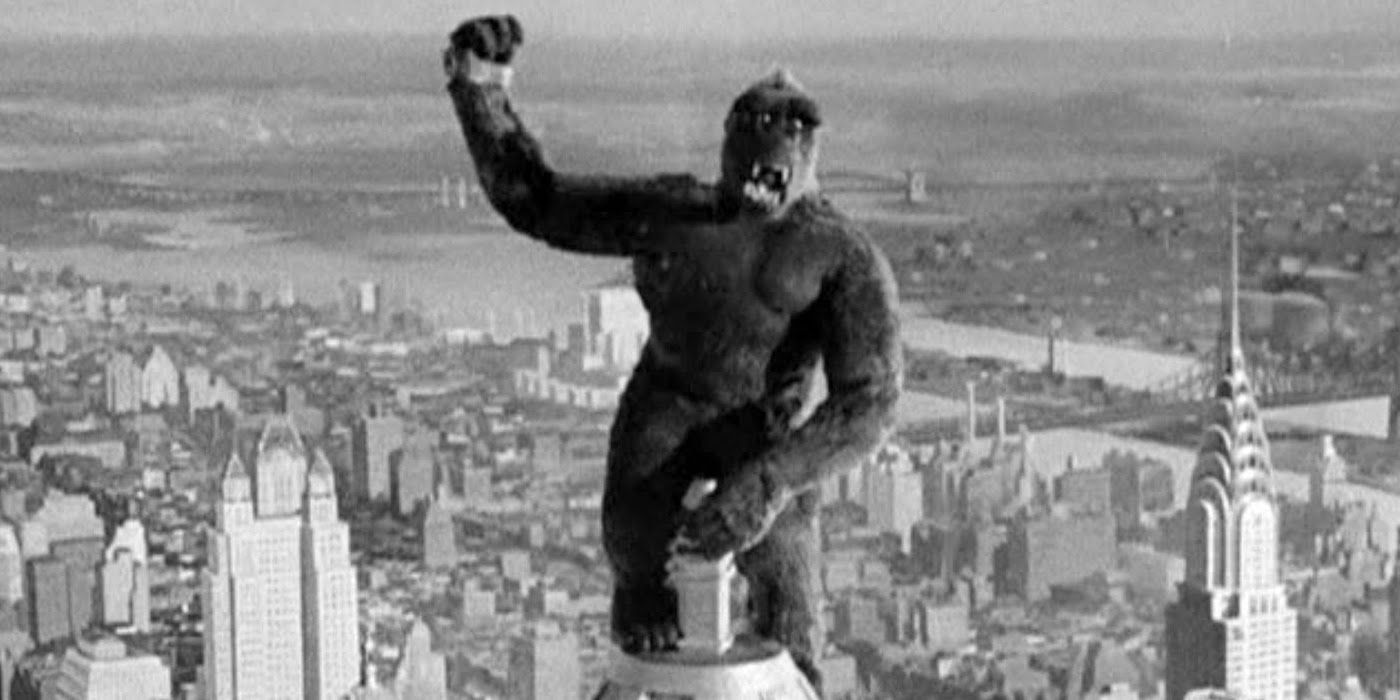 King Kong (1933) stands atop a New York City skyscraper.