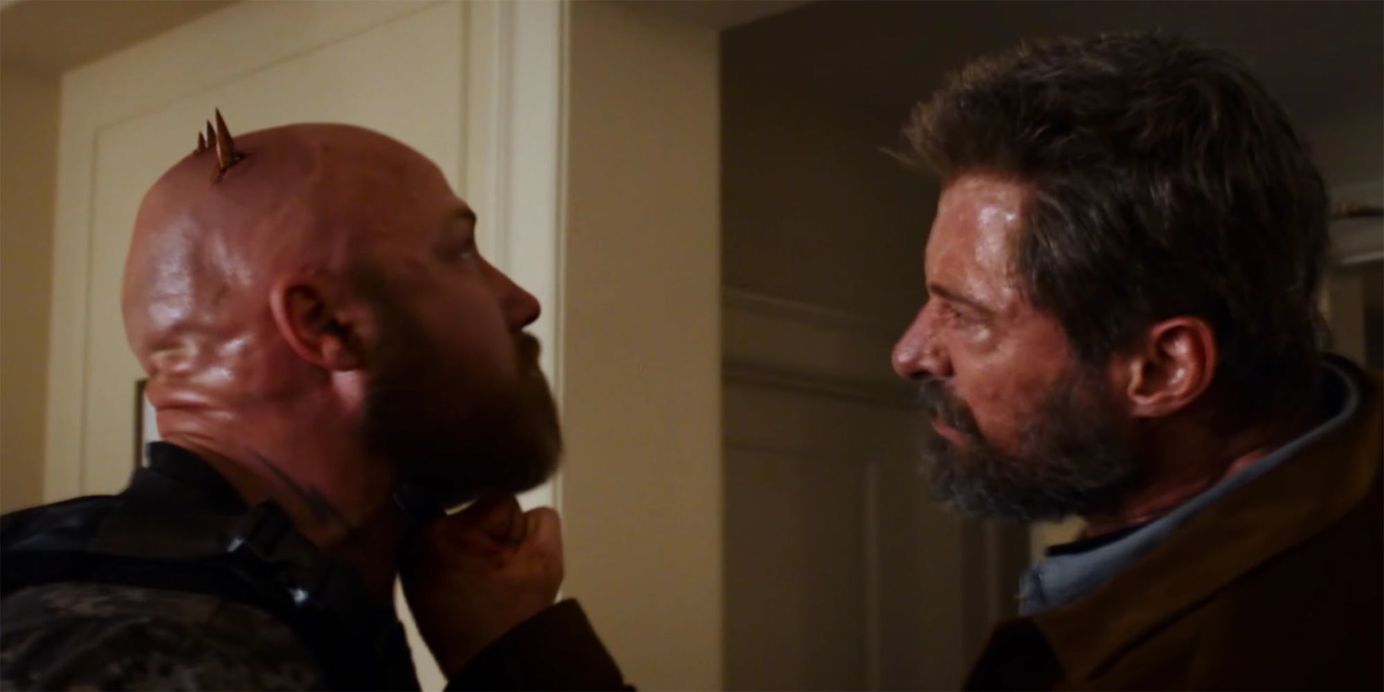 Logan stabbing a guy through the head with his claws