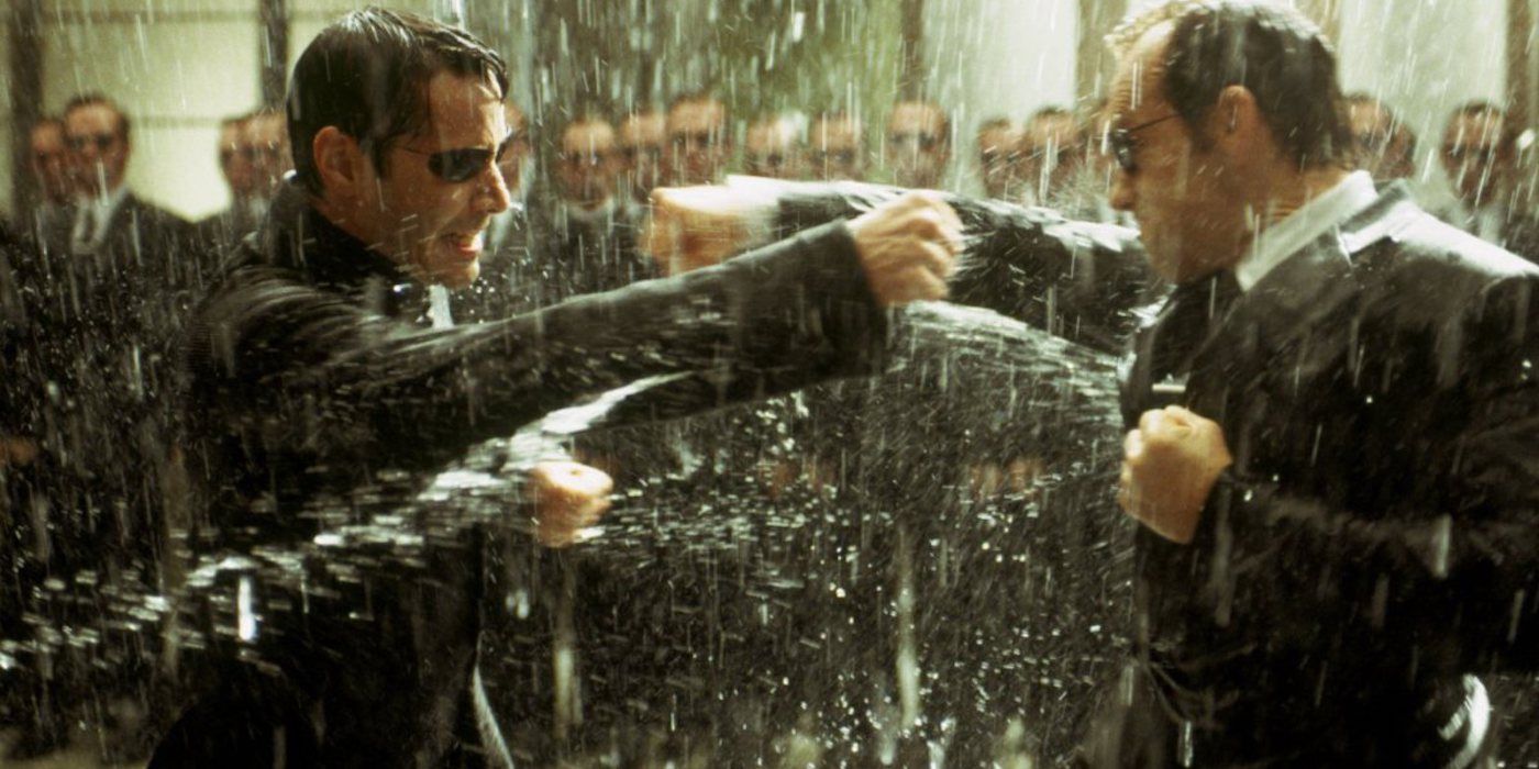Neo and Agent Smith fight in the rain