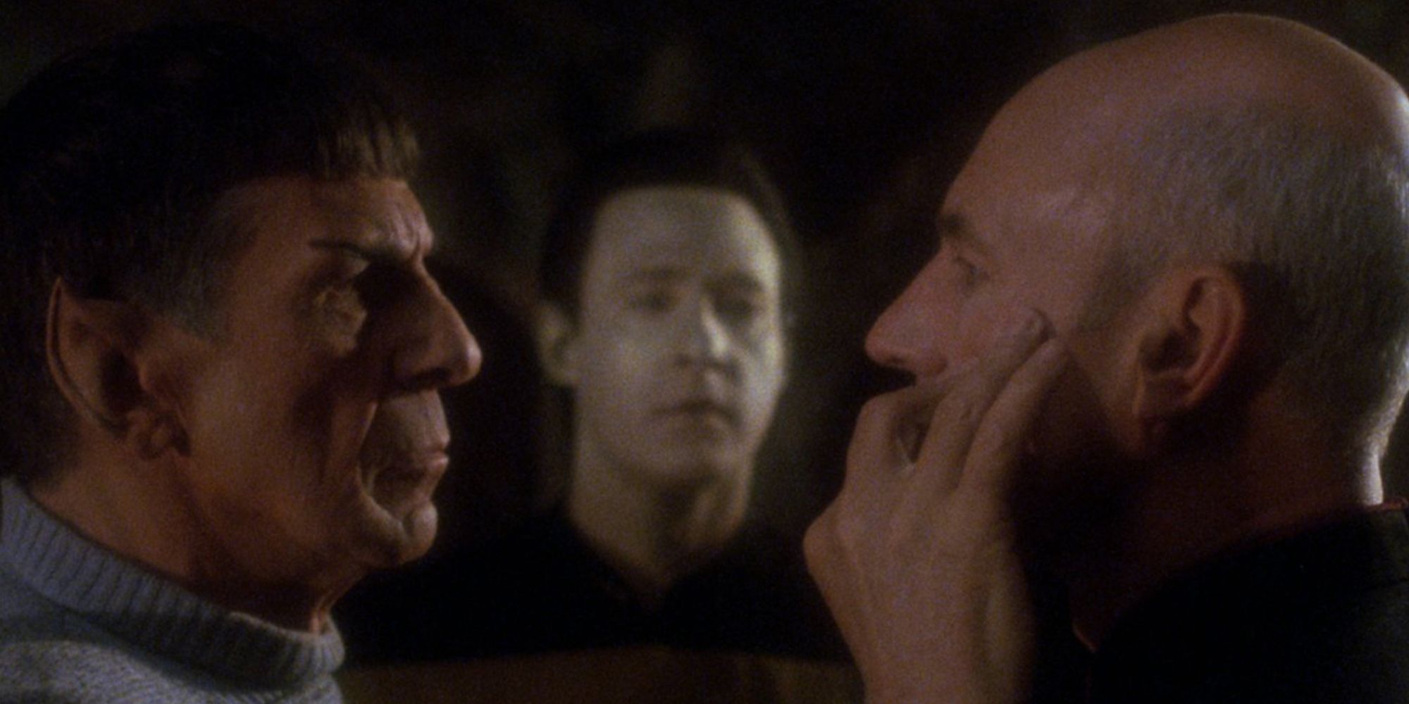 Spock mind-melding with Picard as Data watches