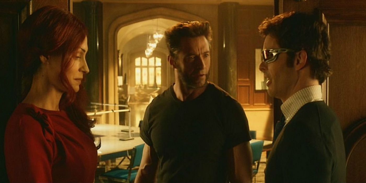 Wolverine between Cyclops and Jean Grey talking