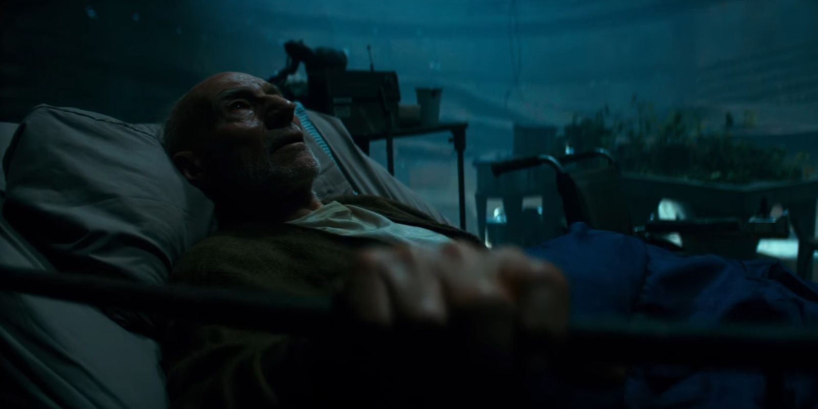 Patrick Stewart as Charles Xavier in confinement in Logan