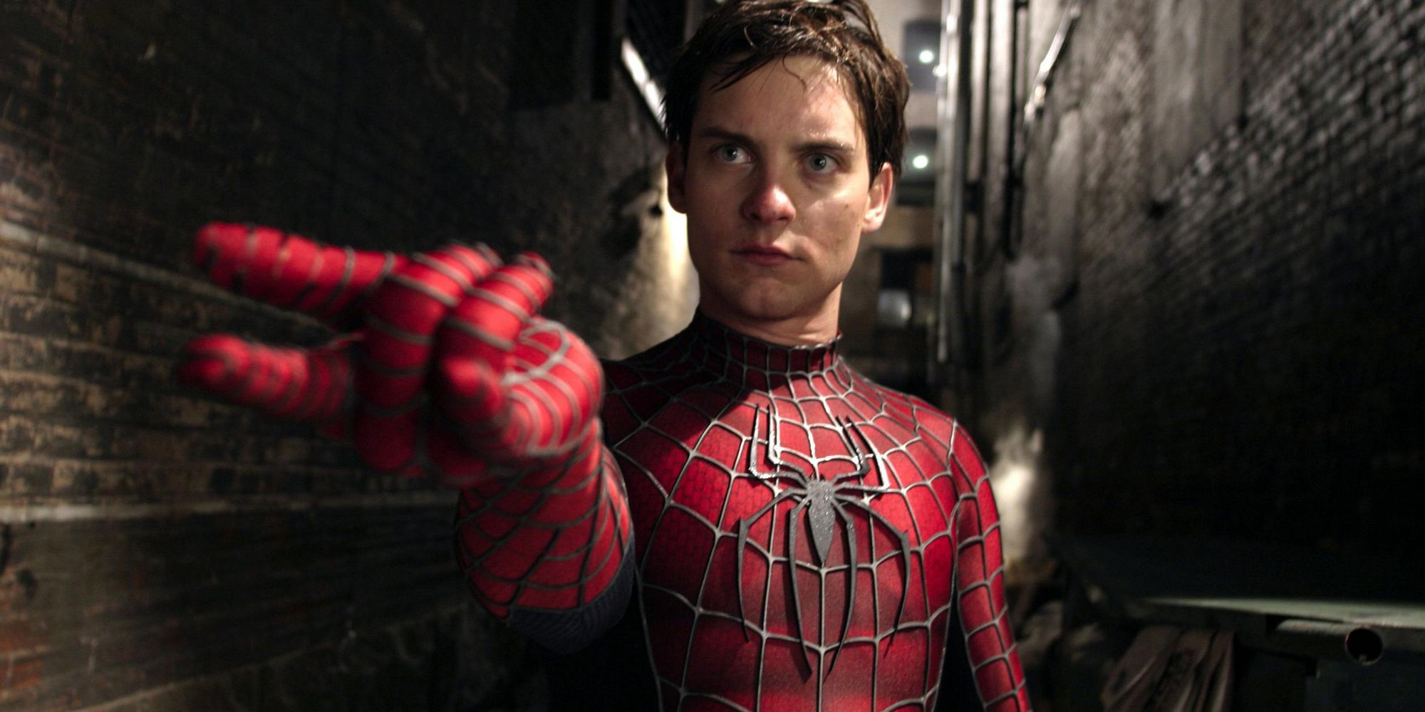 Tobey Maguire's Spider-Man shooting webs in an alley