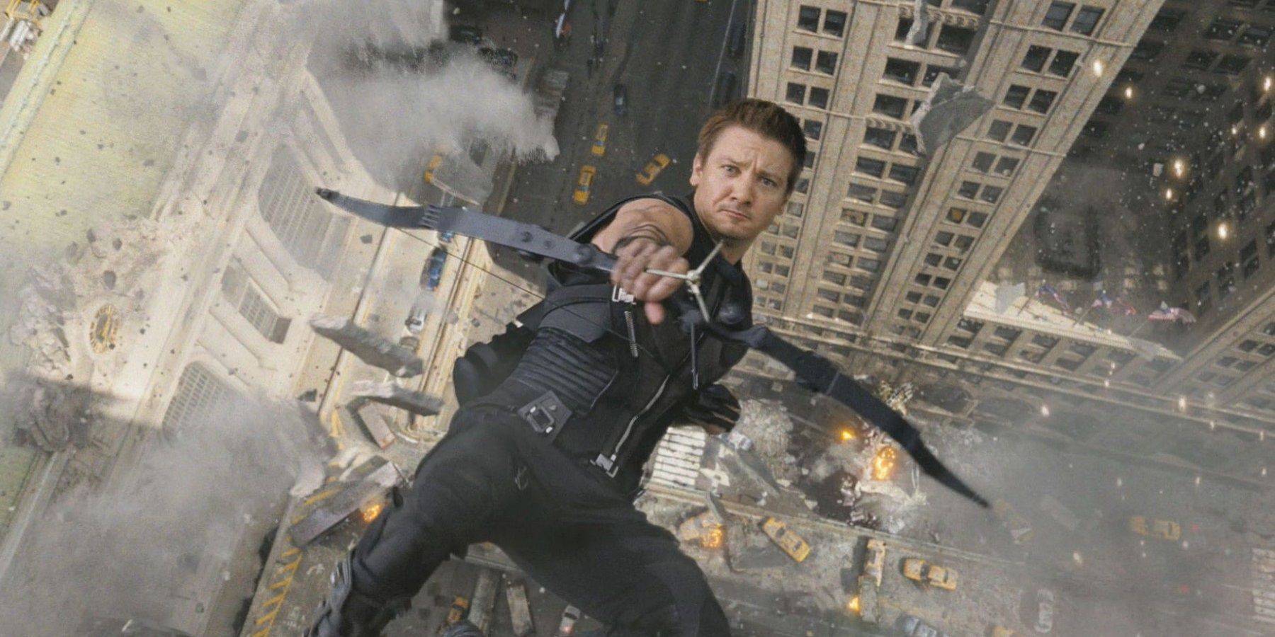 Hawkeye aiming at camera while falling off a building