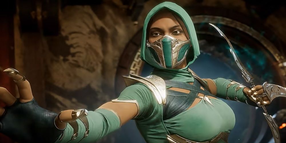 Hooded and masked jade prepares to fight with arms in stance Mortal Kombat 11 intro scene.