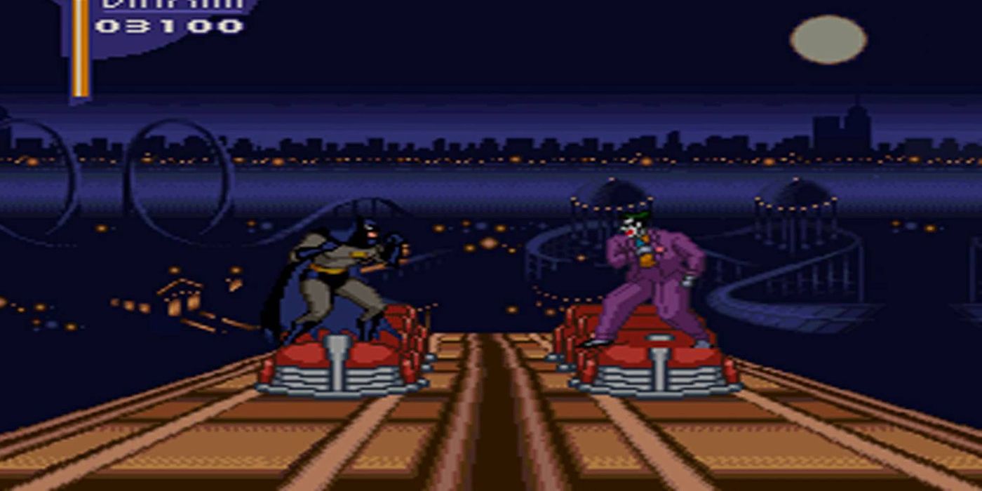 Batman faces off against the Joker atop a roller coaster.