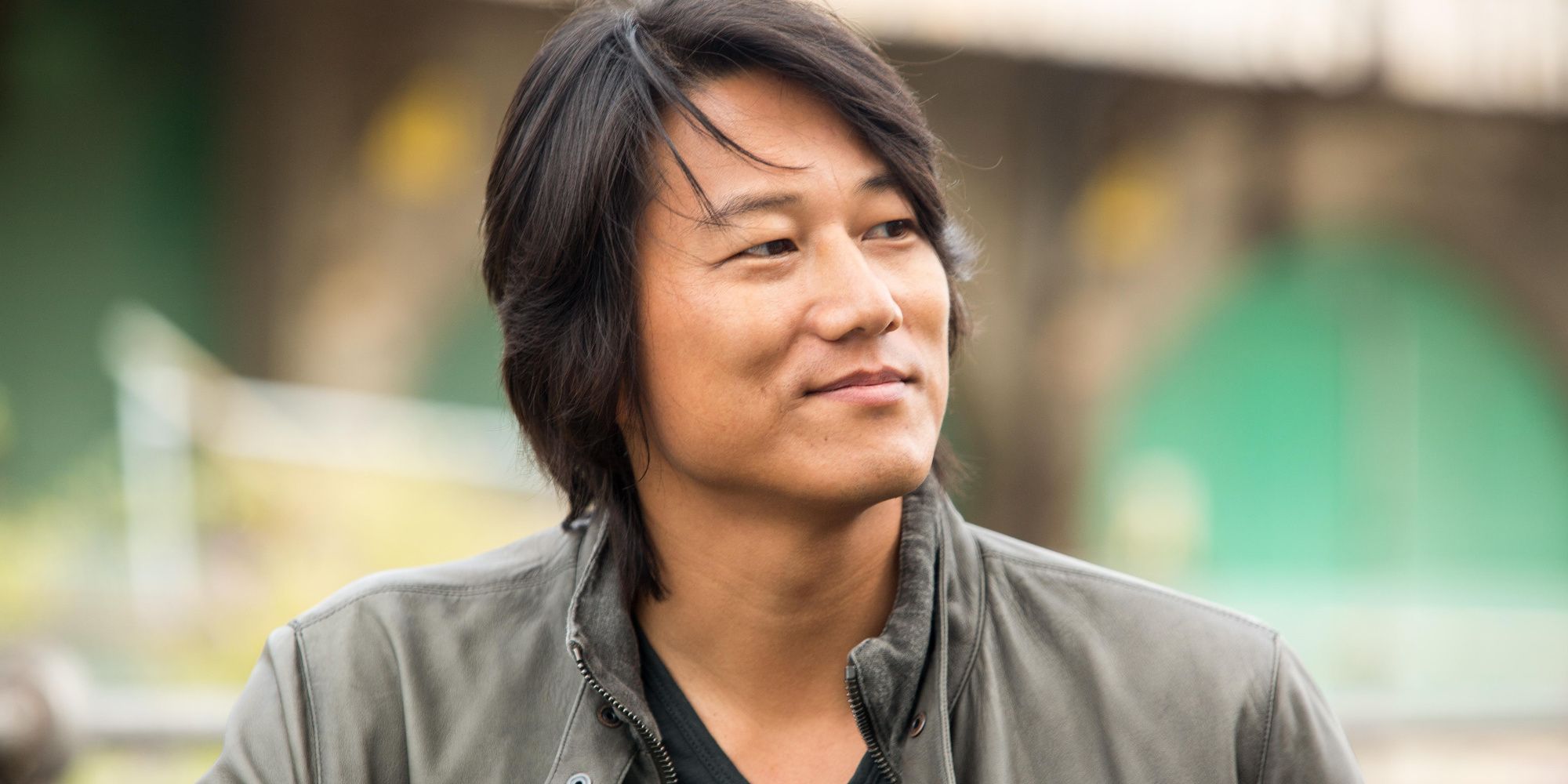Han (Sung Kang) smiles in The Fast and the Furious Tokyo Drift
