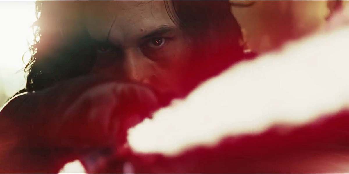 Kylo Ren Glares From Behind His Ignited Lightsaber In Star Wars: The Last Jedi