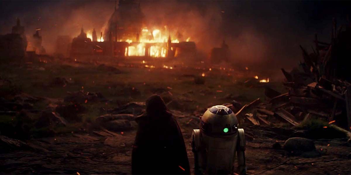 Luke and R2-D2 watch the Jedi temple burn in a flashback from The Jast Jedi