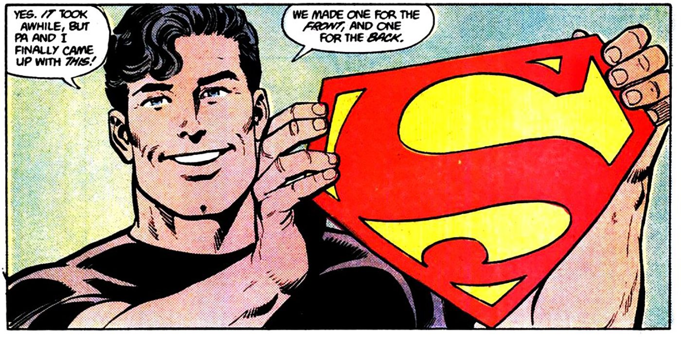 Clark Kent holding Superman Symbol