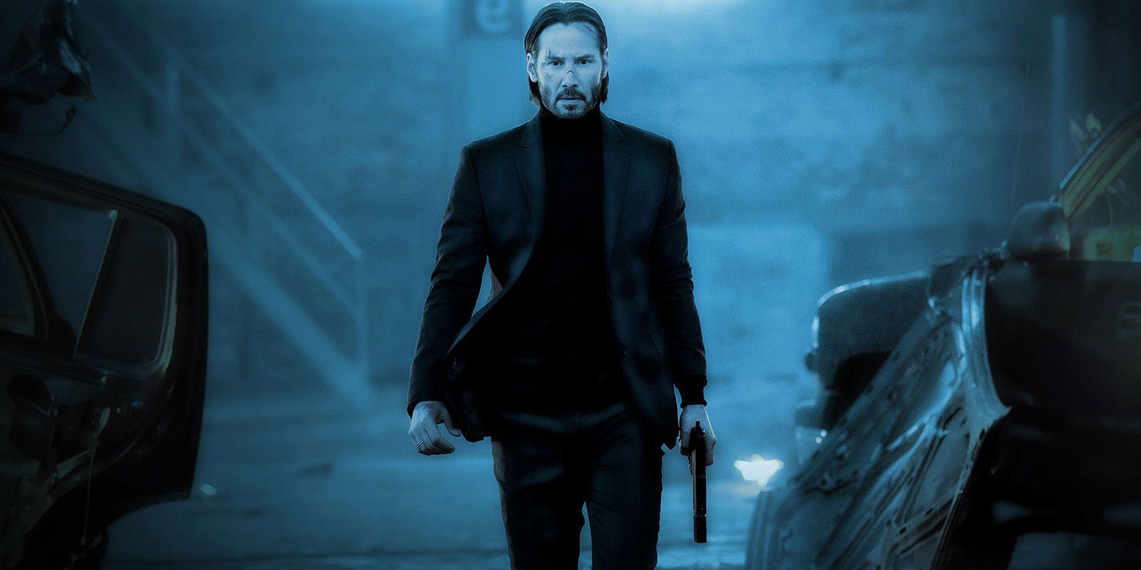Keanu Reeves as John Wick holding a gun in an alley