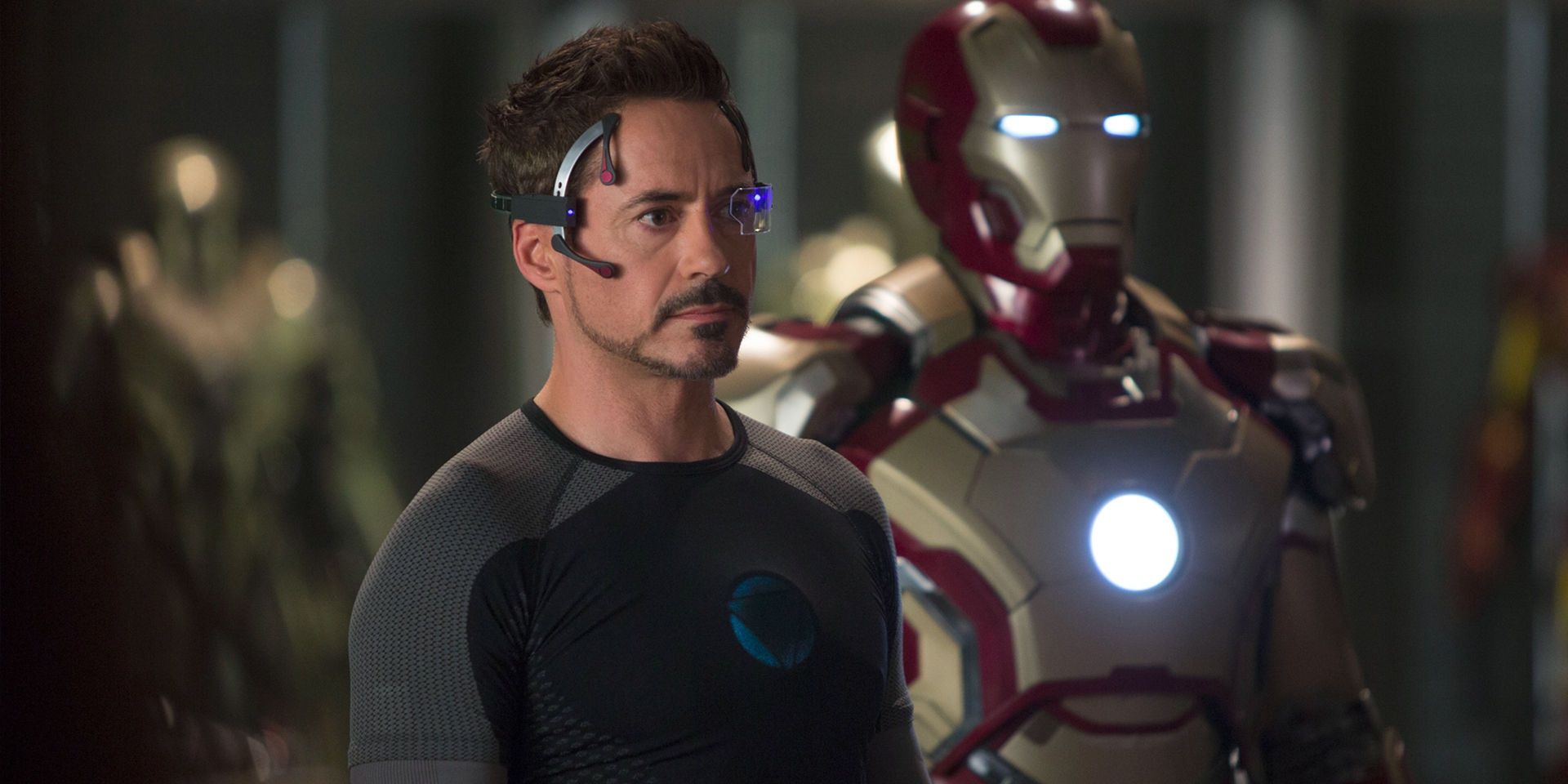 RDJ's Tony Stark alongside the Iron Man armor in the MCU