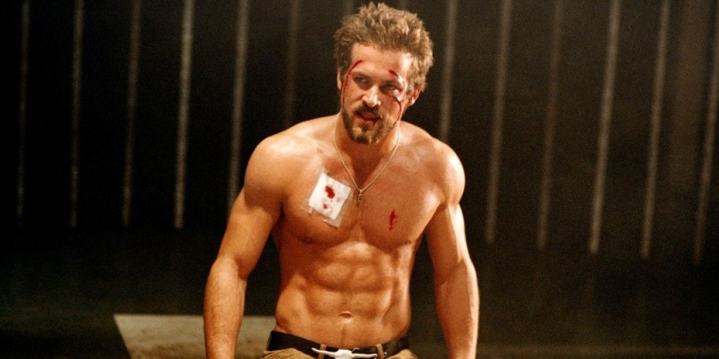 Blade: Trinity's Hannibal King (Ryan Reynolds) standing shirtless in a room with a beat up face. 
