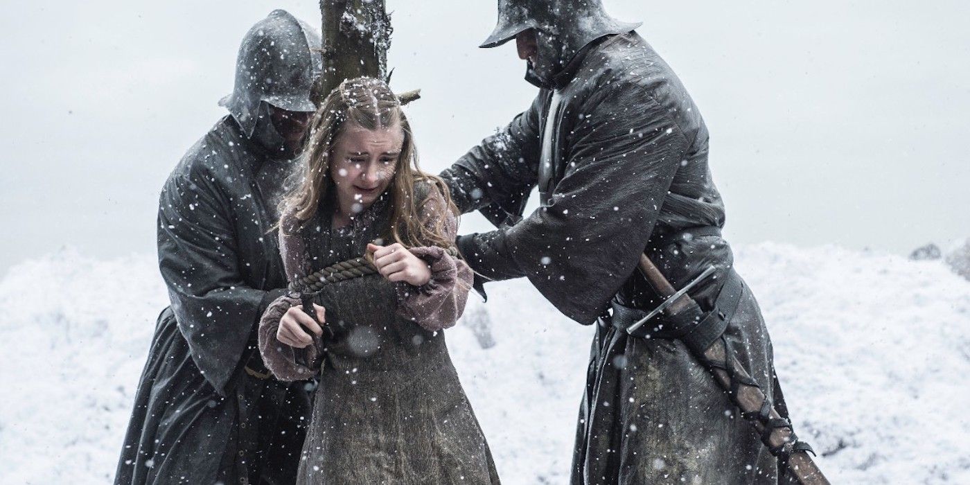 Baratheon soldiers tie Shireen to a wooden post