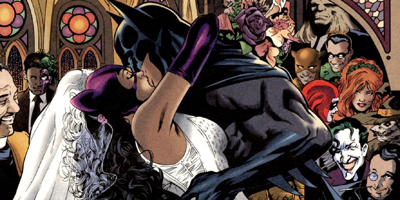 Batman kissing Catwoman as Joker and other villains watch in Bronze Age DC comics