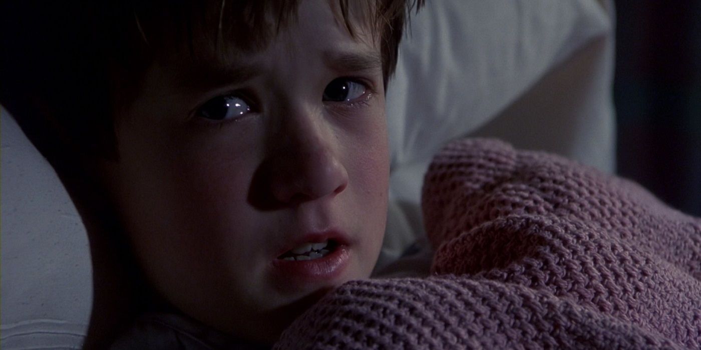 Cole Sear lying in bed, scared from The Sixth Sense
