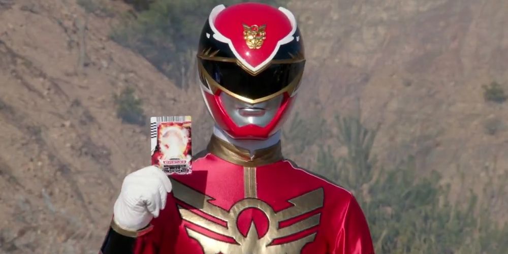 The red Tensou Sentai Goseiger Ranger holding his card