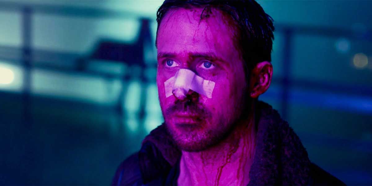 K looks at a purple hologram in Blade Runner: 2049