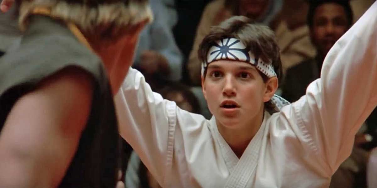 Daniel (Ralph Macchio) prepares a crane kick in The Karate Kid.