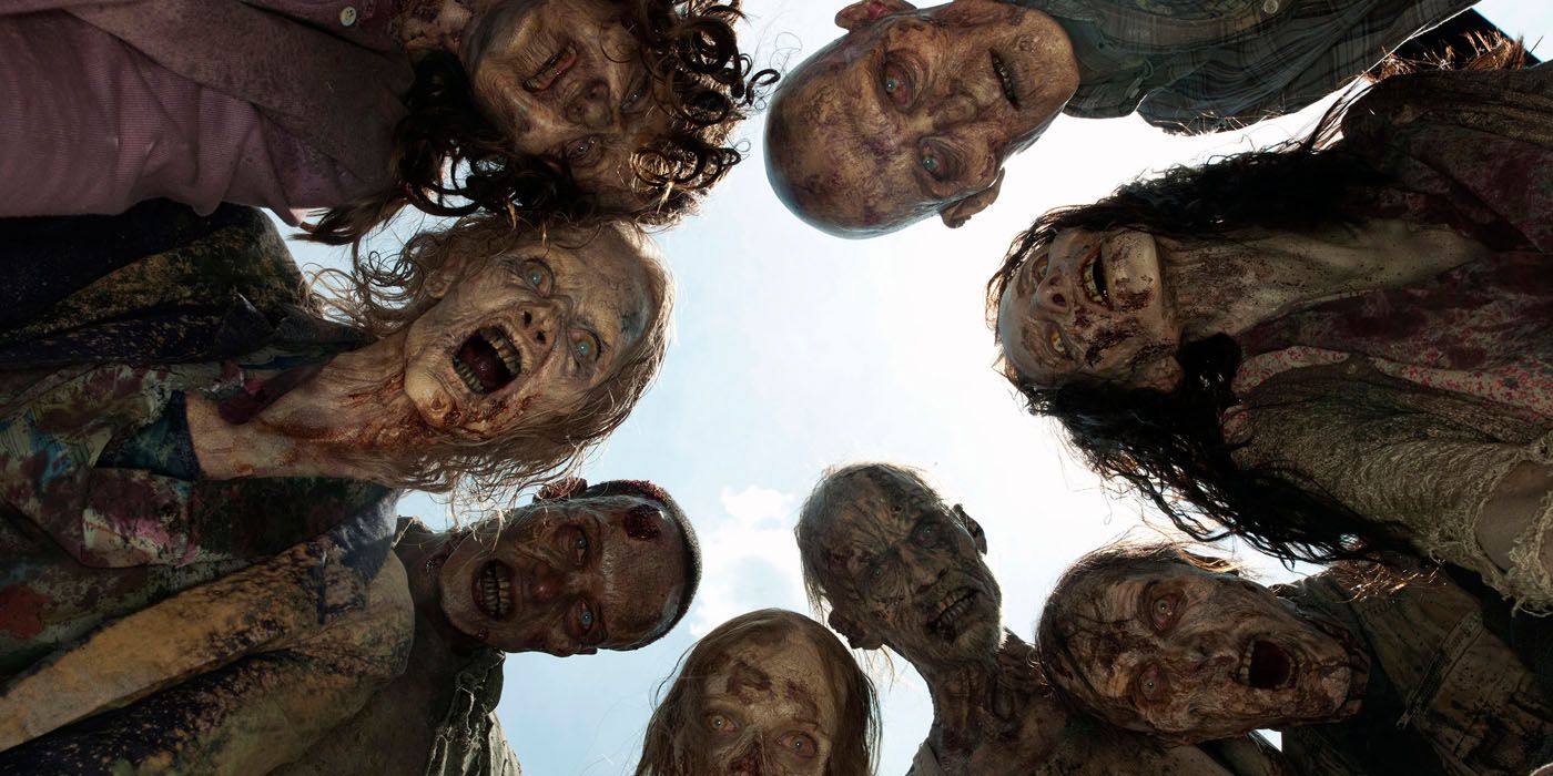 Zombies from The Walking Dead looking down on the camera.