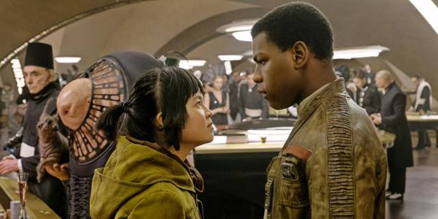 Rose Tico and Finn looking at each other in a casino on Canto Bight in Star Wars: The Last Jedi