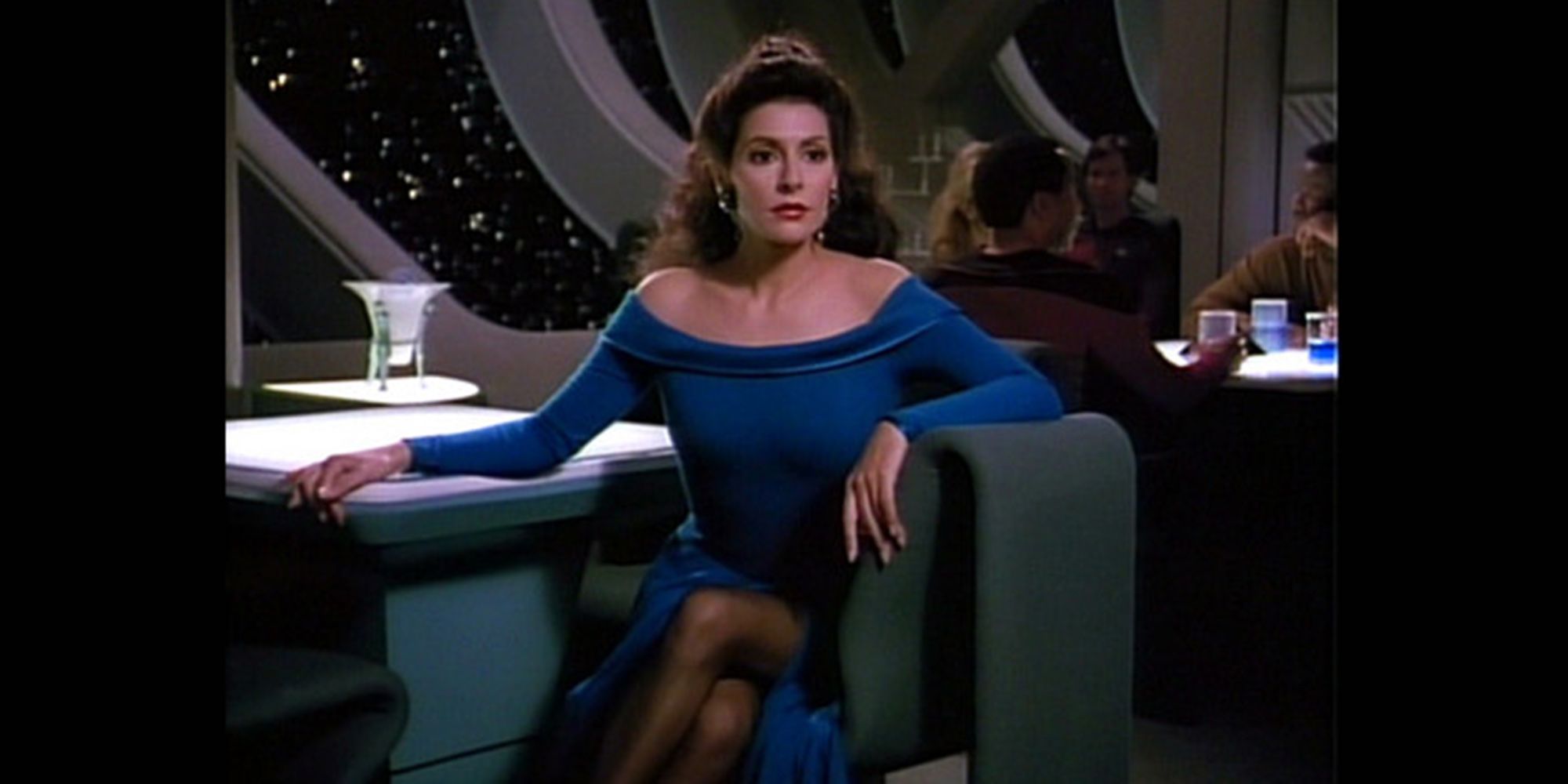 Deanna Troi in The Next Generation sitting down.