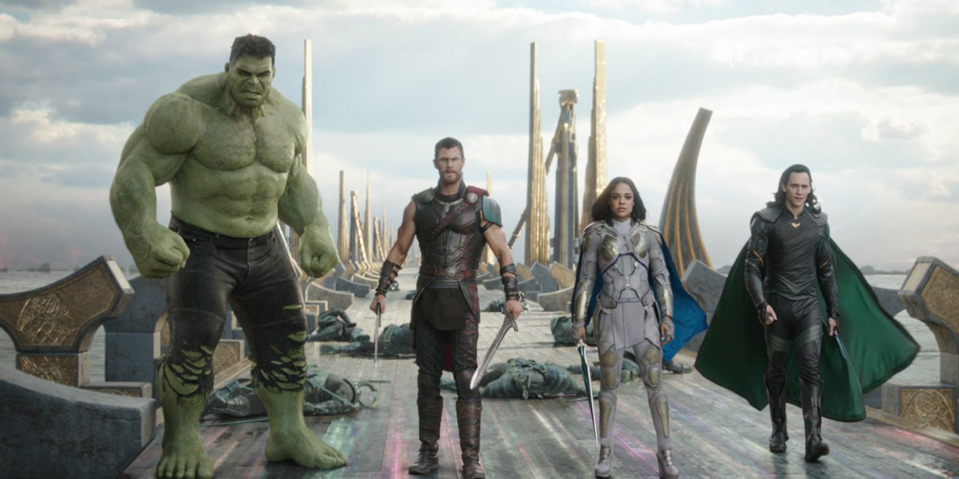 Hulk, Thor, Valkyrie, and Loki stand on the Rainbow Bridge in Thor: Ragnarok