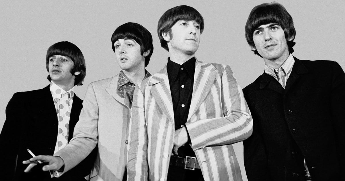 Black and White image of The Beatles looking in different directions