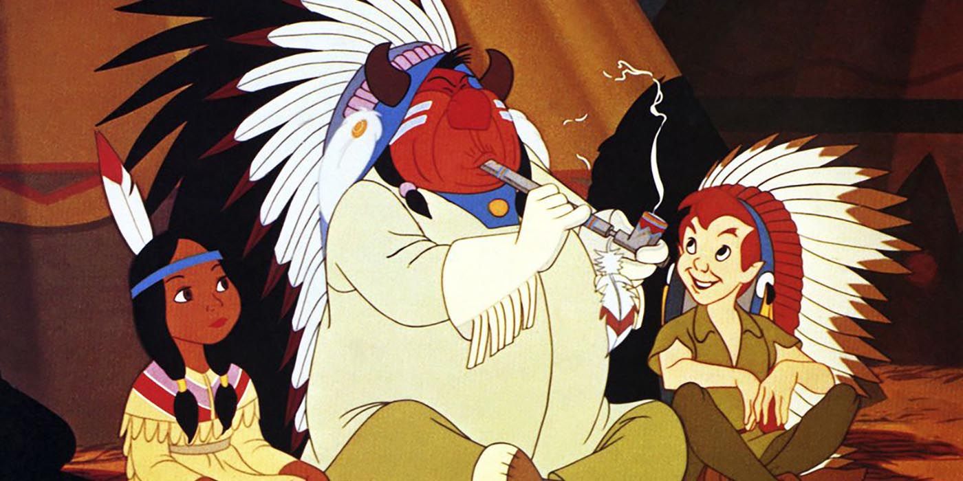 Peter Pan sitting with two Native Americans, the chief smoking a pipe