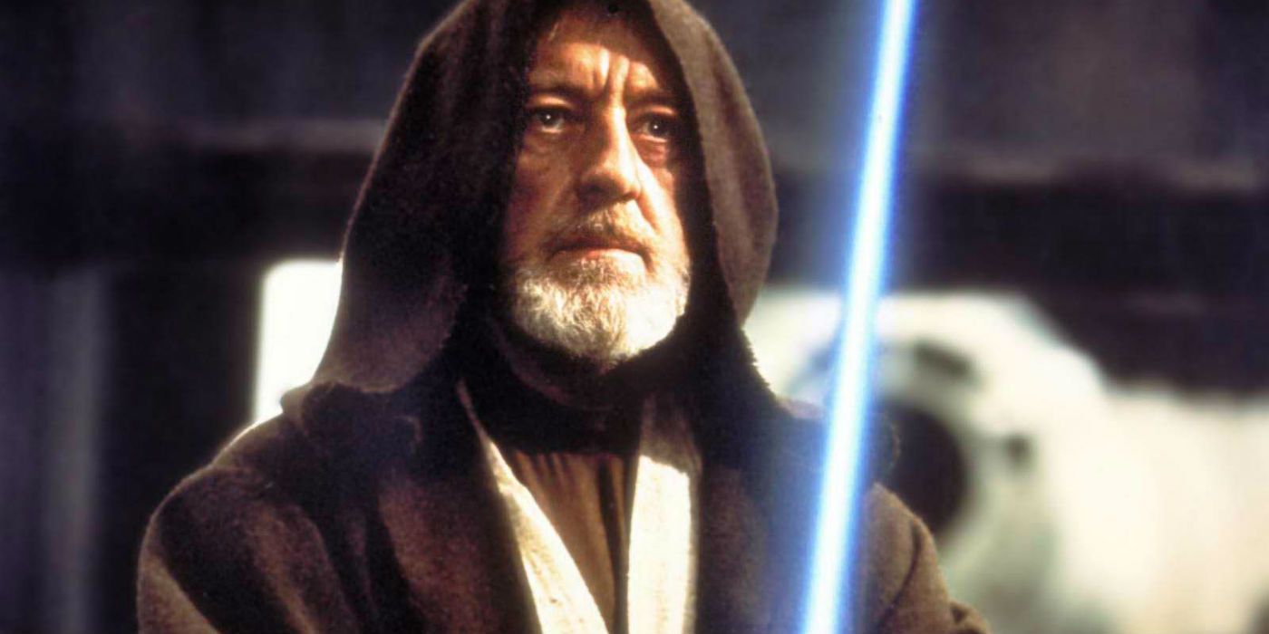 A hooded Ben Kenobi raises his lightsaber to duel Darth Vader in A New Hope
