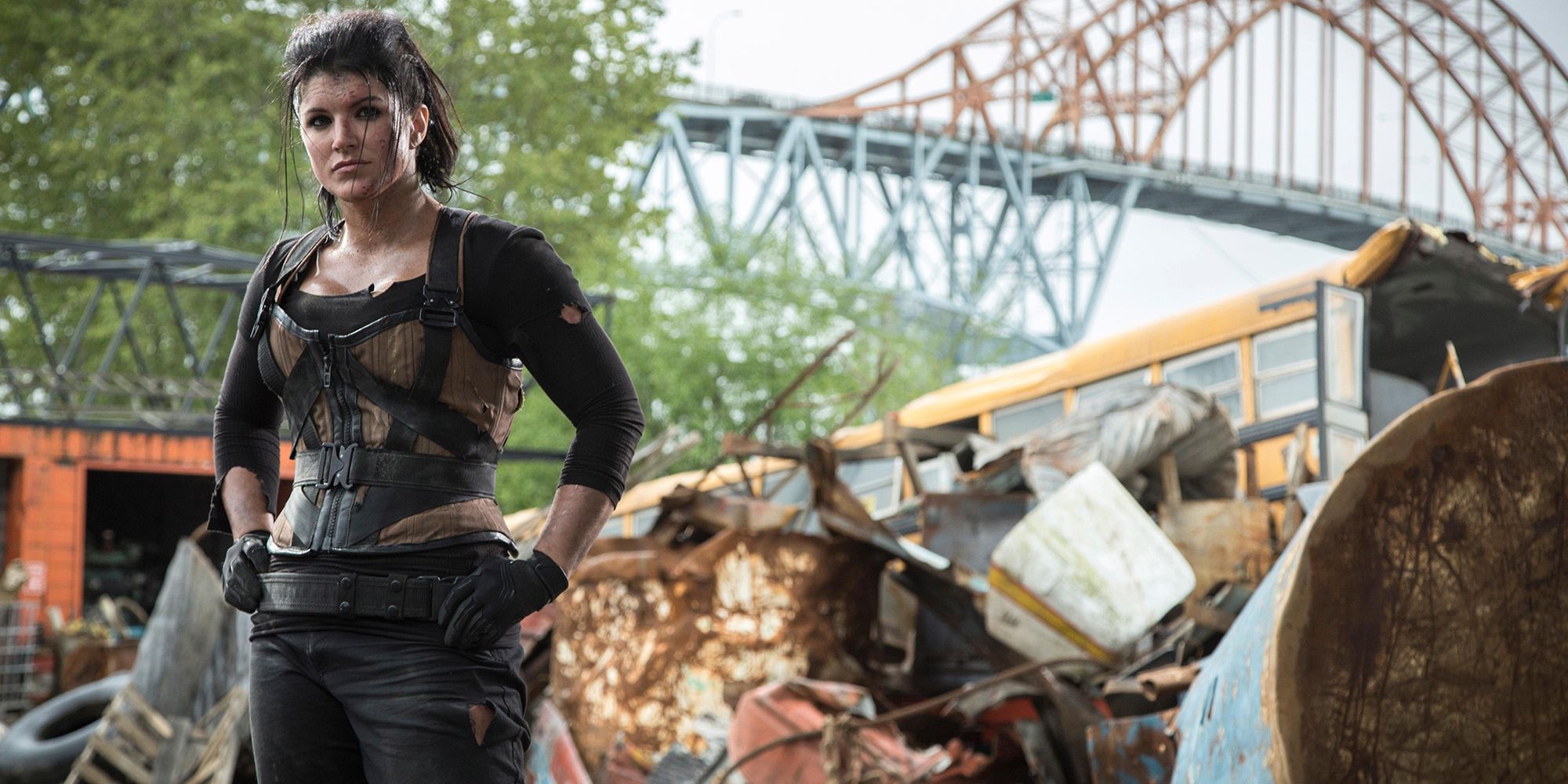 Gina Carano's Angel Dust stands in wreckage from Deadpool