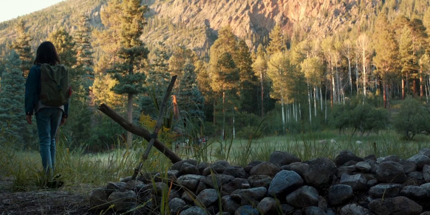 Laura walks away from Logan's grave in the film Logan.