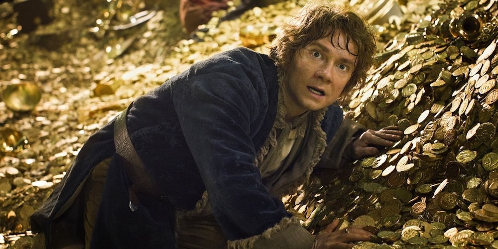 Bilbo cowering in Smaug's treasure in The Hobbit: The Desolation of Smaug